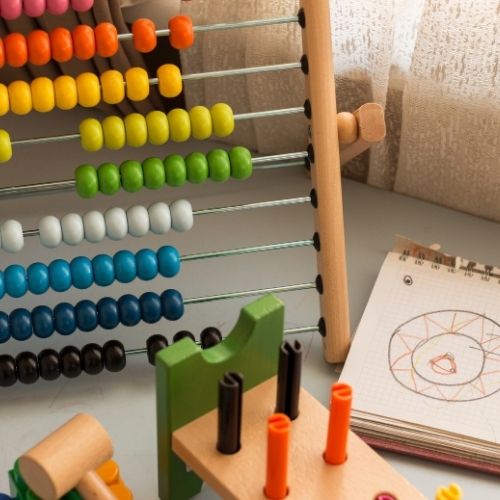 Image of a rainbow abacus and wooden child's toy