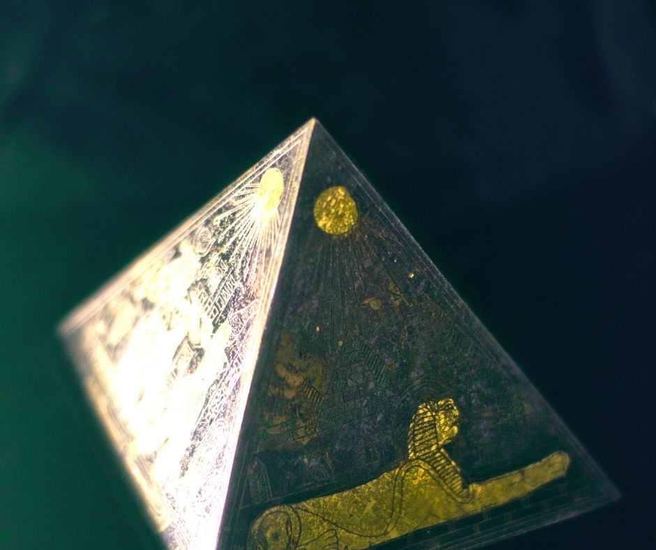 image of a pyramid with a sphinx on it. the small pyramid seems to be in a dark room - is it a clue? a secret? you'll have to read on to find out!
