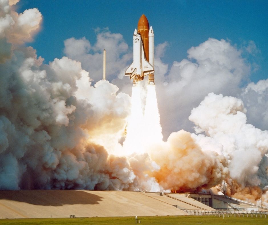 image of an american shuttle launching into space.