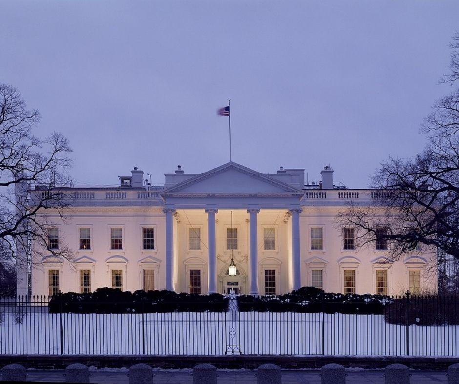 Image of the white house on a snowy and slightly purple tinted day