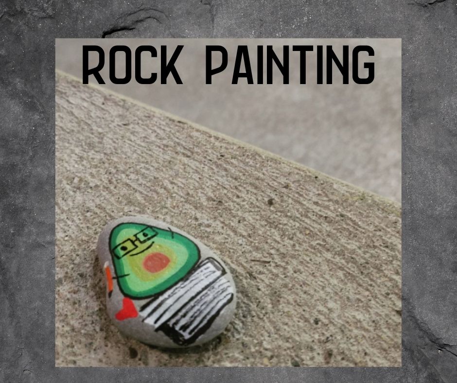 Image of a happy little avocado painted on a rock text reads 'rock painting'