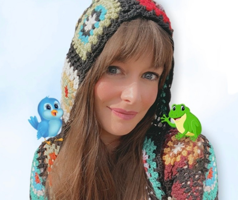 image of a woman in a crocheted hoodie with an animated blue bird on one shoulder and an animated frog on the other